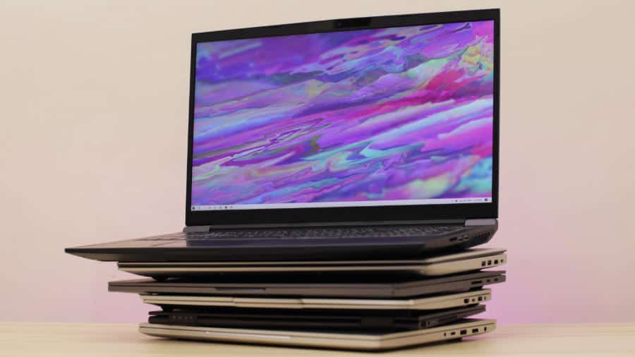 a-stack-of-laptops-with-a-gaming-laptop-on-top 2